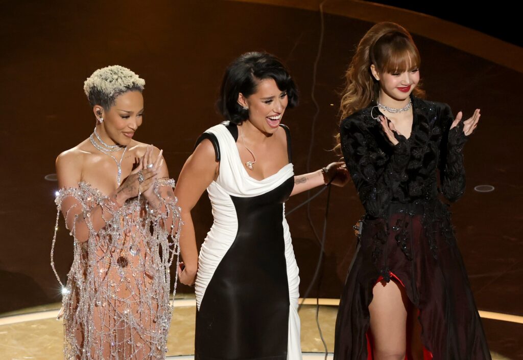 Watch BLACKPINKs Lisa, Doja Cat, and RAYE transform into Bond Girls at the 2025 Oscars