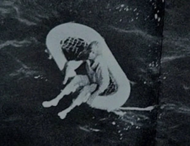 After the ship's captain slaughtered her family, scuttled the boat, and dinghied to safety,u00a0Terry Jo Duperrault floated 84 hours on a piece of corkboard too small to lay down and without food, water, or shelter. This is the photo beginning the rescue.