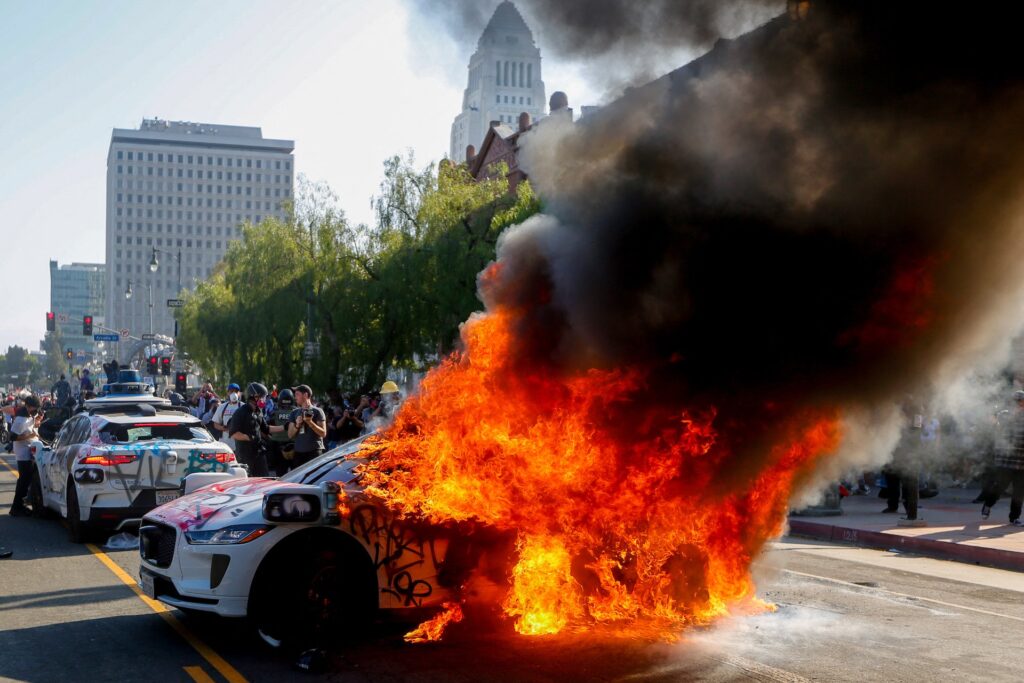 Waymo cuts off L.A. taxi service after cars are set on fire